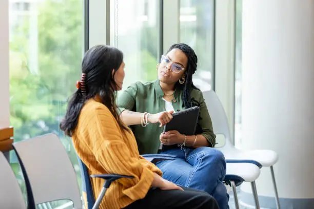 A parent and clinician talking together